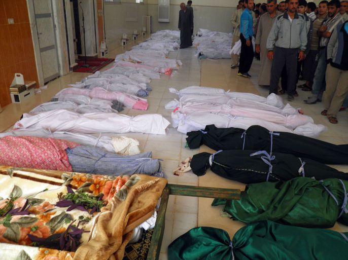 handout image released by the Syrian opposition's Shaam News Network on May 26 , 2012, shows the bodies of killed people made ready for burial in the town of Houla. The head of a UN mission warned of "civil war" in Syria