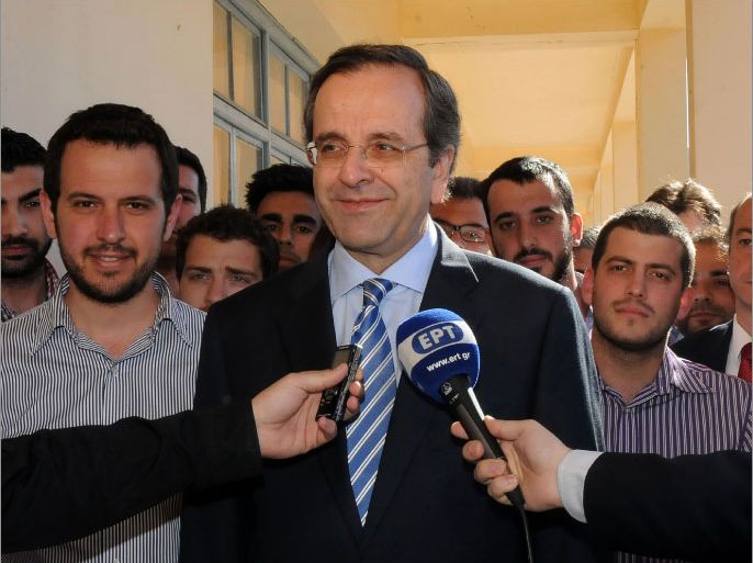 Leader of the New Democracy conservative party, Antonis Samaras, makes statements to the press at a polling station in the city of Pylos, southwest of Athens, on May 6, 2012. Greeks voted today in a tough-to-predict general election that threatened to turn the crisis-hit country's old political system on its head and bring eurozone turmoil back with a vengeance. AFP PHOTO / NEW DEMOCRACY CONSERVATIVE PARTY / WILLY ANTONIOU