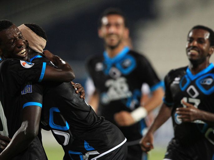 Emirate's Baniyas players celebrate after winning 2-0 against Uzbekistan's Pakhtakor during their AFC Champions League, Group B, football match at the Baniyas Club in Abu Dhabi on May 16, 2012. AFP PHOTO/JOSEPH CAPELLAN