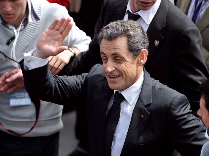 France's incumbent President and UMP ruling party candidate for the 2012 presidential election Nicolas Sarkozy waves to supporters as he leaves after a campaign meeting on May 4, 2012 in Les Sables-d'Olonne near La Rochelle, western France. AFP