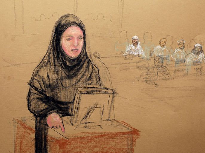 CUBA, Guantanamo Bay : In this courtroom drawing reviewed and approved for release by a US military security official, Pentagon paid civilian defense lawyer Cheryl Borman, defending accused 9/11 co-conspirator Walid bin Attash, argues a point in an abaya at the arraignment on May 5, 2012 at the US Naval Base in Guantanamo Bay, Cuba. Khalid Sheikh Mohammed, self-confessed mastermind of the 9/11 attacks, and four co-defendants appeared in a in court to be arraigned, all facing the death penalty if convicted. Mohammed and the other accused plotters challenged the court with small acts of defiance before being formally charged with planning and executing the September 11, 2001 attacks. The suicide attacks by Al-Qaeda militants in hijacked airliners killed 2,976 people in New York, Washington and Shanksville, Pennsylvania. AFP PHOTO/POOL/JANET HAMLIN
