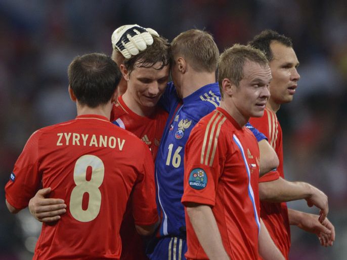 Russian players celebrate at the end of the Euro 2012 football match Russia vs. Czech Republic, on June 8, 2012 at the Municipal stadium in Wroclaw. AFP PHOTO / FABRICE COFFRINI
