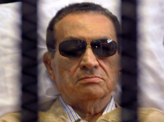 EGYPT (FILES) -- File picture of ousted Egyptian president Hosni Mubarak shows him sitting inside a cage in a Cairo courtroom during his verdict hearing on June 2, 2012.