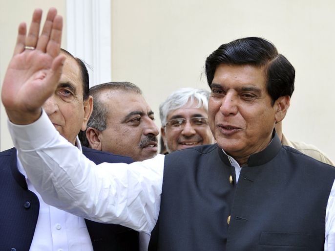 Newly elected Pakistan Prime Minister Raja Pervez Ashraf waves to the media as leaves after a meeting with the main coalition party of Pakistan Muslim League Quaid (PMLQ) in Islamabad on June 22, 2102. MPs elected Raja Pervez Ashraf as Pakistan's new prime minister on June 22, in a bid to end a crisis sparked by judges ousting the premier and demanding the arrest of his would-be successor. The national assembly rubber stamped Ashraf's appointment by 211 votes in the 342-member lower house of parliament, dominated by the main ruling Pakistan People's Party (PPP) and its fractious coalition members. AFP