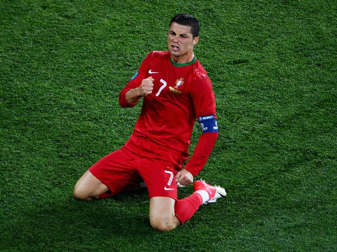 KHARKOV, UKRAINE - JUNE 17: Cristiano Ronaldo of Portugal celebrates scoring his team's second goal during the UEFA EURO 2012 group B match between Portugal and Netherlands at Metalist Stadium on June 17, 2012 in Kharkov, Ukraine. (Photo by Lars Baron/Getty Images)
