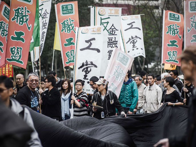 مظاهرة في مارس/آذار الماضي طالبتبحريات أكبر وضمان حق الانتخاب المباشرلحاكم هونغ كونغ (الفرنسية-أرشيف)