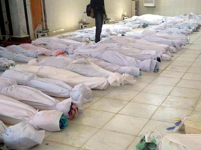 epa03240652 An image that was published by Syrian citizen platform Houla Media Center on 26 May 2012 and offered for download on its facebook page shows bodies covered in white shrouds, allegedly killed in the massacre in Houla, Homs province, Syria, 25 May 2012. Syrian authorities deny any responsibility of Syrian forces in the Houla massacre that left more than 100 civilians dead, among them many women and children.