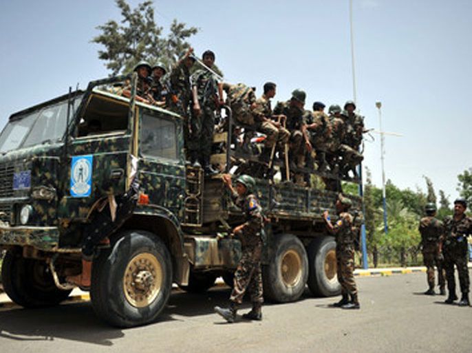 epa03262890 Yemeni soldiers on a security truck patrol at a street, a day after the army forces cleared al-Qaeda militants from two southern towns, in Sana'a, Yemen, 13 June 2012. According to media reports, the Yemeni authorities tightened up security measures across the country, a day after the army routed al-Qaeda militants from their key strongholds of Zinjibar and Jaar in south Yemen. Supported directly from the US and tribal fighters, the Yemeni army stepped few months ago the offensive against al-Qaeda militants, killing and injuring hundreds of them, including senior leaders, reports claimed. EPA/YAHYA ARHAB