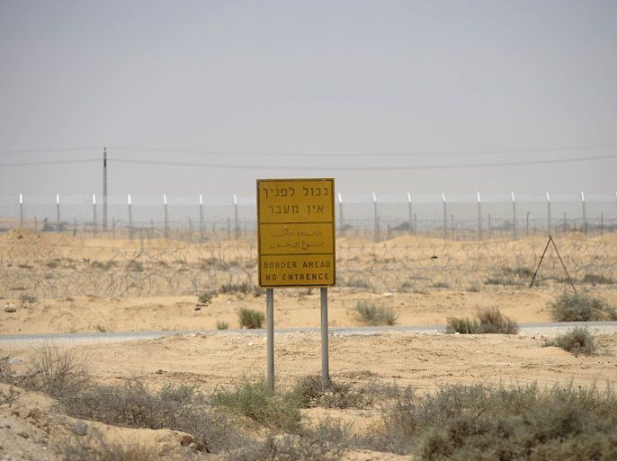 An Israeli sign is seen on the border with Egypt near the Israeli village of Beer Milka on June 18, 2012 as Israel continues the hunt for up to four gunmen who infiltrated the Egyptian border and staged a deadly ambush, killing one Israeli and sparking a firefight which left two militants dead. AFP