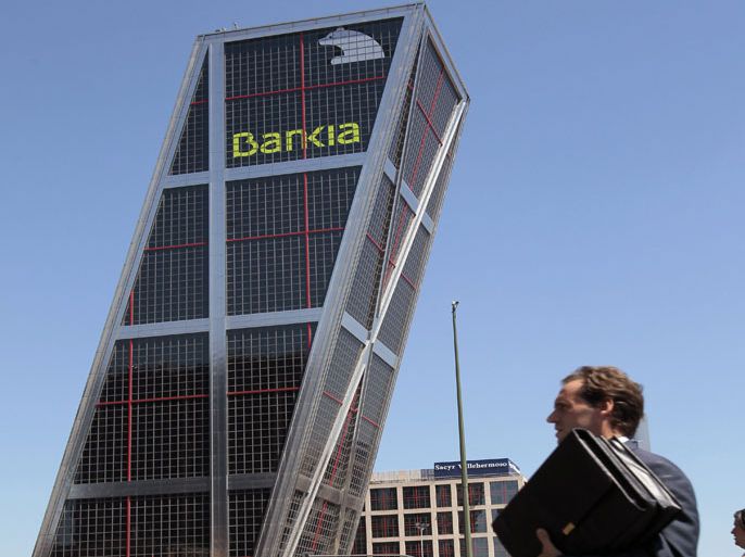 epa03228678 (FILE) File picture taken 15 July 2011 shows the Bankia headquarters, formerly the CajaMadrid headquarters, in Madrid, Spain, 15 July 2011. Troubled Spanish bank Bankia will need more funds than expected from the state following its recent nationalization, Economy Minister Luis de Guindos said, 21 May 2012. Bankia will need up to 7.5 billion euros (9.6 billion dollars) in addition to the 4.5 billion euros in credits that were initially injected into it from