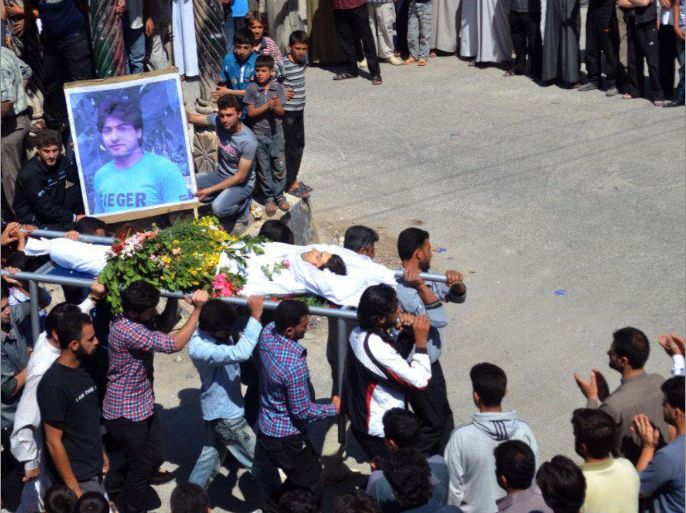 A handout image released by the Syrian opposition's Shaam News Network on June 9, 2012, shows Syrians carrying the body of a youth allegedly killed in a Syrian government offensive, during his funeral in the town of Kfar Nubul in Idlib province on June 8, 2012. The Syrian army killed at least 23 civilians on June 9 in the flashpoint southern city of Daraa and six in the central city of Homs, the Syrian Observatory for Human Rights said. AFP PHOTO/HO --- RESTRICTED TO EDITORIAL USE - MANDATORY CREDIT "AFP PHOTO / HO / SHAAM NEWS NETWORK" - NO MARKETING NO ADVERTISING CAMPAIGNS - DISTRIBUTED AS A SERVICE TO CLIENTS - AFP IS USING PICTURES FROM ALTERNATIVE SOURCES AS IT WAS NOT AUTHORISED TO COVER THIS EVENT, THEREFORE IT IS NOT RESPONSIBLE FOR ANY DIGITAL ALTERATIONS TO THE PICTURE'S EDITORIAL CONTENT, DATE AND LOCATION WHICH CANNOT BE INDEPENDENTLY VERIFIED ---