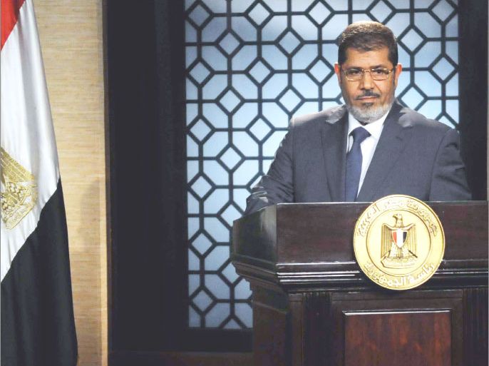Egypt's new president-elect, Muslim Brotherhood leader Mohamed Morsi, gives a speech in the studio of the state television in Cairo on June 24, 2012 after winning the Egyptian presidential elections. Morsi, the country's first elected leader since a popular uprising ousted president Hosni Mubarak, won 51.73 percent of the vote against ex-premier Ahmed Shafiq. AFP PHOTO / STR