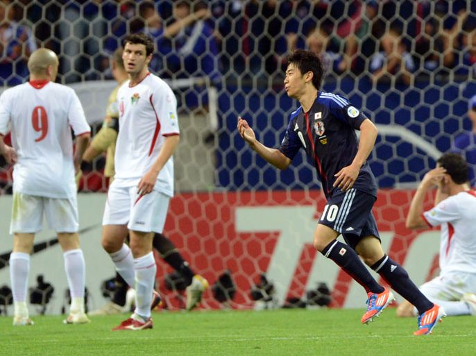 Japan's forward Shinji Kagawa (2nd R) celebrates his goal during their 2014 World Cup Asian qualifier football match against Jordan in Saitama on June 8, 2012. AFP PHOTO / TOSHIFUMI KITAMURA