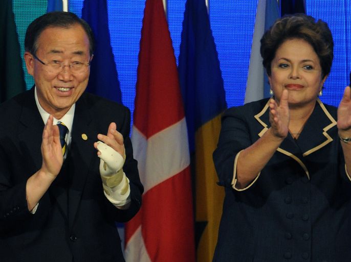 UN Secretary General Ban Ki-Moon and Brazil's President Dilma Rousseff applaud at the end of the UN Conference on Sustainable Development Rio+20 closing ceremony, in Rio de Janeiro, on June 22, 2012. World leaders on Friday endorsed a statement on fighting poverty and