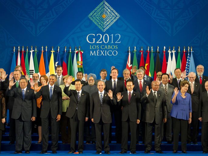 Cabo San Lucas, Baja California Sur, MEXICO : Heads of the G20 leading economies pose for a family photo at the convention center in Los Cabos, Mexico, on June 18, 2012. The leaders of the world's most powerful economies meet for a G20 summit confronted by turmoil in the eurozone, a critical election in Greece and worsening
