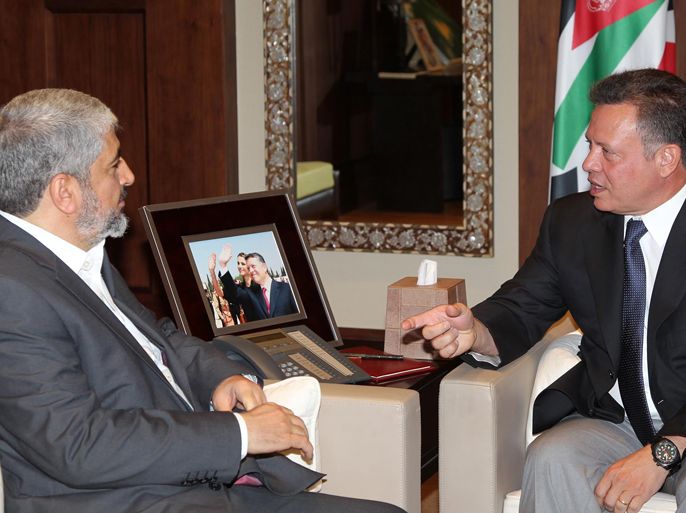 A handout picture released by the Jordanian Royal Palace shows Jordan's King Abdullah (L) shaking hands with Hamas chief Khaled Meshaal during their meeting in Amman on June 28, 2012. This is Meshaal's second visit to Jordan this year to boost ties with the kingdom. AFP
