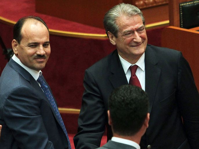 GEN01 - Tirana, -, ALBANIA : Albania's Prime Minister Sali Berisha congratulates Albania's Interior Minister Bujar Nishani (L) after he was elected Albania's new president in a parliament vote in Tirana on July 11, 2012