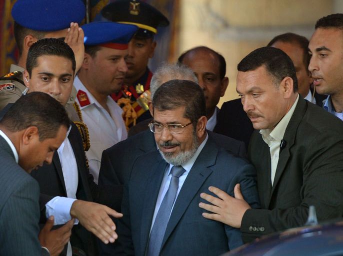 Egyptian president-elect Mohamed Morsi (C) leaves al-Azhar mosque after performing Friday prayers, in Cairo on June 29, 2012, the eve of his swearing-in as Egypt's first civilian president. AFP