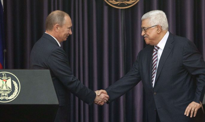Palestinian Authority President Mahmud Abbas (R) and Russia's President Vladimir Putin shake hands at a joint news conference in the West Bank Biblical town of Bethlehem on June 26, 2012, during a rare trip aimed at boosting Russia's regional role. AFP