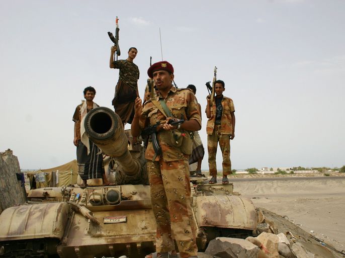 Yemeni army troops patrol the road between the provincial capital Zinjibar and the town of Jaar in the southern restive region of Abyan on June 22, 2012. Landmines planted in Yemen's southern province of Abyan by Al-Qaeda militants before they were driven out from the area have killed at least 35 people in the past 10 days, officials said. AFP