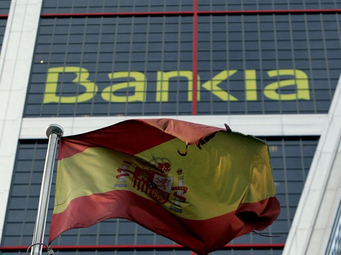 epa03257086 (FILE) A file photo dated on 01 June 2012 of the Bankia head office, based in Kio Towers in Madrid, Spain. The Spanish Economy Minister Luis de Guindos announced 09 June 2012 that Spain will ask eurozone partners to bail out its banking sector. In the last few weeks, Spain's third-largest lender, Bankia, has revealed its serious need of cash. EPA/KIKO HUESCA