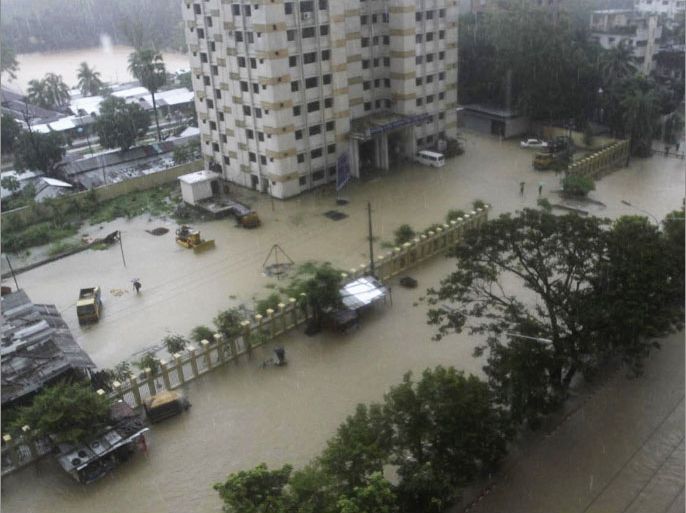 A street is seen submerged by flood water in Chittagong June 26, 2012. At least six people have died by different landslides in Chittagong and Cox's Bazar as heavy rainfall submerged the port city, local media reported.