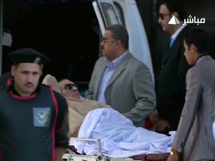 An image grab taken from Egyptian state TV shows ousted Egyptian president Hosni Mubarak being wheeled on a stretcher into a court in Cairo on June 2, 2012. Mubarak will learn whether he is guilty of the murder of demonstrators during the uprising that overthrew him last year. AFP
