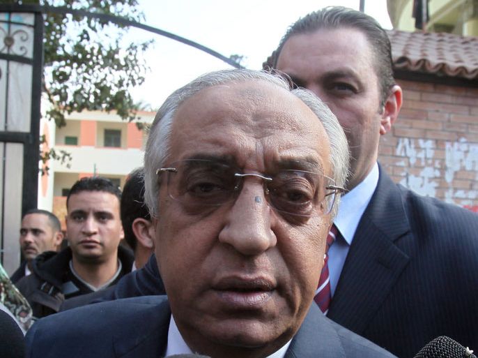 Egyptian Minister of Interior Mohamed Ibrahim Youssef (C) speaks to reporters after visiting a polling center to inspect security measures during the second round of parliamentary elections, in Giza, Egypt, 15 December 2011. Reports state that polling stations in nine Egyptian governorates re-opened on 15 December for a second round of voting in the country's parliamentary elections amid low voter turnout. About 18.7 million people are eligible to cast their ballots in the current round, which sees 3,387 candidates contest 180 seats. EPA/KHALED ELFIQI