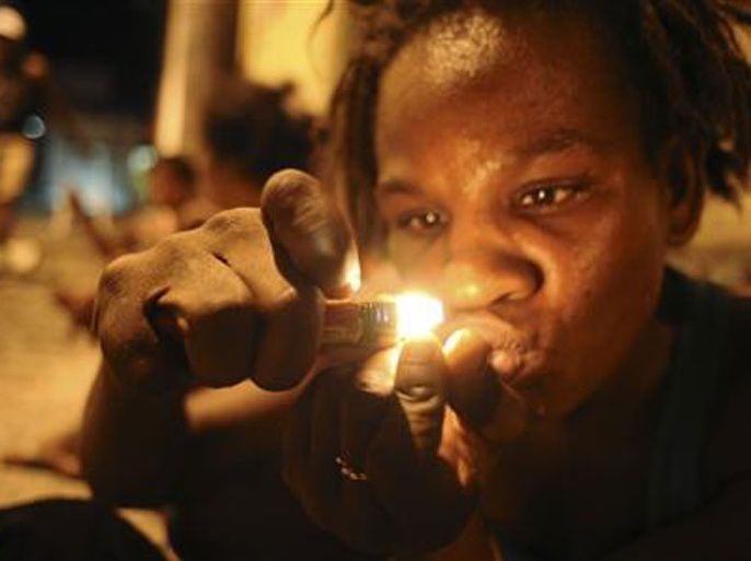 A drug user consumes crack in the old center of Salvador da Bahia March 19, 2012. _ reuters