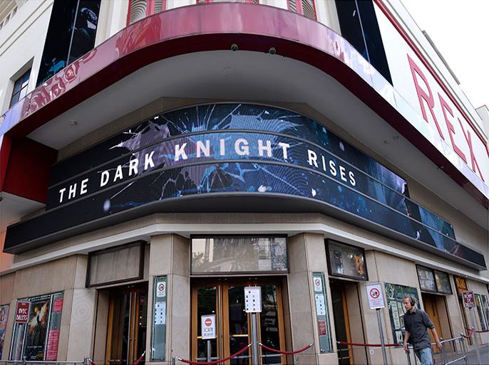 epa03312610 An electronic marquee sign advertises the movie 'The Dark Knight rises' at Le Grand Rex theatre in Paris, France, 20 July 2012. The premiere of the new Batman film at the Gaumont Champs-Elysees theatre was cancelled on 20 July 2012 after a gunman killed 12 people and wounded 50 in a shooting incident at the premiere of 'The Dark Knight Rises' in the Town Center Mall in Aurora, Colorado, USA. Actors Morgan Freeman, Christian Bale, Anne Hathaway and other stars had been due to attend the event in Paris. EPA/CHRISTOPHE KARABA