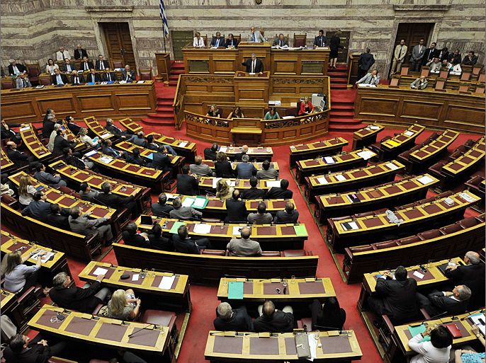 Empty sits of Left Coalition, Democratic Left and Communist party lawmakers are seen during the speech of the leader of the Ultra Nationalist Golden Dawn party, Nikolaos Michaloliakos, at the Greek parliament in Athens on July 7, 2012. The debate on the coalition government’s policy program continues for a second day, with a view to the vote of confidence to the government, scheduled for midnight on Sunday. AFP PHOTO / LOUISA GOULIAMAKI