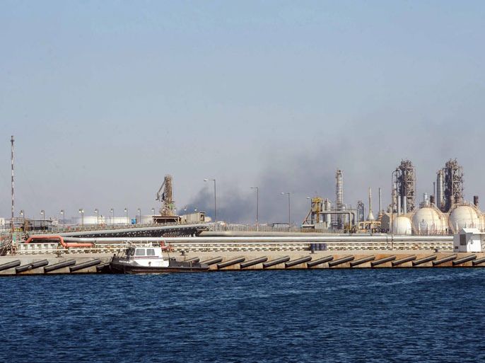 epa03133948 (FILE) A file picture dated 26 August 2011 shows smoke rising from an oil refinery in the eastern oil town of Brega, Libya. Media reports on 06 March 2012 state that civic leaders in the oil-rich eastern region of Libya declared a semi-autonomy. The decicion reportedly was made by a meeting of some 2,000 people near Benghazi. EPA/STR