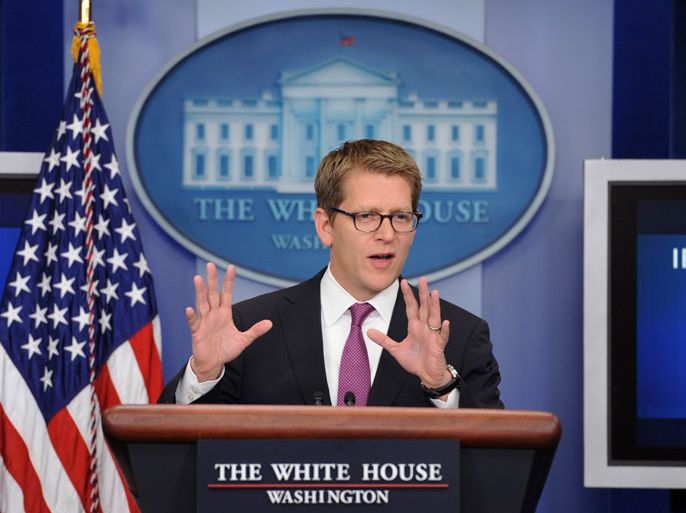 epa03040515 White House Press Secretary Jay Carney responds to a question from a member of the news media during a press conference, at the White House in Washington DC, USA, 21 December 2011. President Obama called Speaker of the House John Boehner to urge him to take up the payroll tax cut two-month extension for a House vote. The legislation passed in the Senate with broad bipartisan support. EPA/MICHAEL REYNOLDS