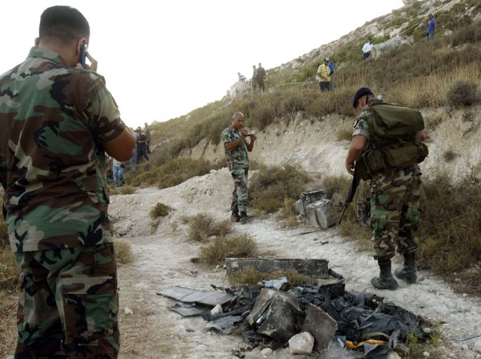LEBANON : Lebanese army soldiers inspect the debris after an Israeli aircraft destroyed a spy device in the Zahrani region, it was using to monitor a Hezbollah communications network in south Lebanon after it was found by the group, a Lebanese security source and Hezbollah said, on July 2, 2012. A similar incident occurred in December last year and again in February 2012. Israel has not commented on the claims. AFP PHOTO/MAHMOUD ZAYYAT