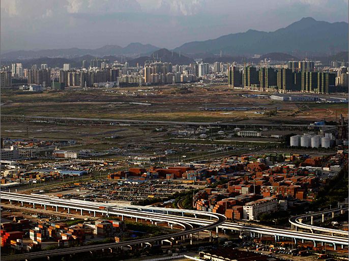 An aerial view of the Qianhai area, an 18-square-kilometre area, is seen in the southern Chinese city of Shenzhen, neighbouring Hong Kong July 7, 2012. China's plan to test yuan convertibility in a new services hub being built near Hong Kong fanned excitement Beijing may be dismantling its rigid capital controls sooner than expected. REUTERS/Tyrone Siu (CHINA - Tags: BUSINESS CITYSPACE)