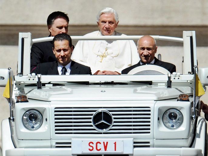 • Caption:A photo dated 16 June 2010 of the pontiff's staff member Paolo Gabriele (L, front), sitting beside the driver of the 'Popemobile' with Pope Benedict XVI (C) being driven on St. Peter's Square, Vatican city. Others are not identified. The Vatican said 25 May that its police is holding a suspect in connection with the 'illegal' possession of classified documents. A person was at the disposal of the Vatican magistrates for ulterior clarification, papal spokesman Father Federico Lombardi was quoted as saying by the ANSA news agency. Lombardi's announcement came a day after the board of the Holy See's bank, the Institute for the Works of Religion (IOR), unanimously voted to dismiss its president, Ettore Gotti Tedeschi, in a decision reportedly linked to the leaking of Vatican documents. The identification of the person, who Lombardi did not name, but whom the Italian daily Il Foglio identified as a pontiff's domestic staff member named Paolo Gabriele, follows an investigation by the Vatican's Gendarmerie corps into the leaking of several documents, including confidential letters written to Pope Benedict XVI. EPA/ETTORE FERRARI