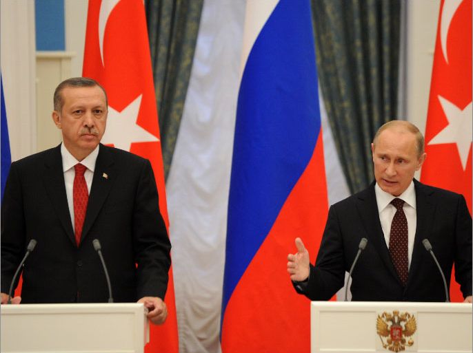 Russian President Vladimir Putin (R) and Turkish Prime Minister Recep Tayyip Erdogan speak during a press conference after their meeting to discuss differences on Syria as UN Security Council prepared to vote on the conflict, in Moscow's Kremlin on July 18, 2012. Russia said today a decisive battle was in progress in Syria and rejected a Western-backed UN resolution on the crisis as it would mean taking sides with a revolutionary movement. AFP PHOTO/KIRILL KUDRYAVTSEV