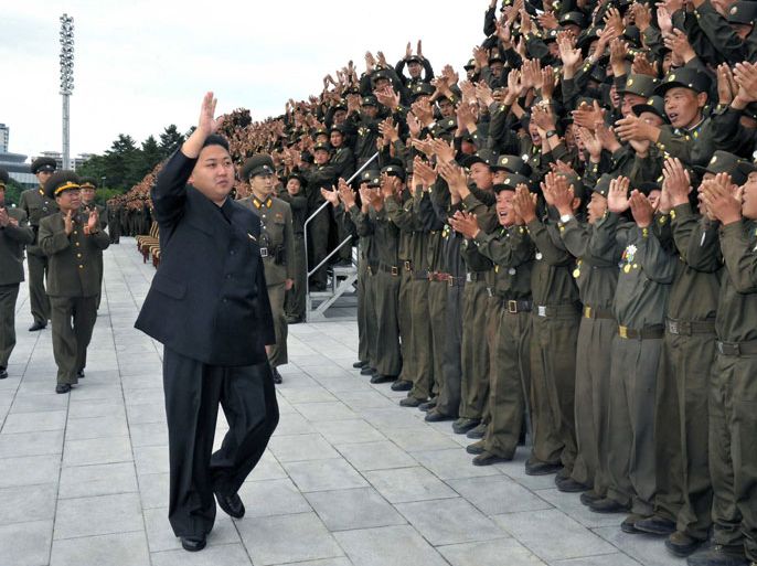 : This undated picture, released from North Korea's official Korean Central News Agency on July 16, 2012 shows North Korean leader Kim Jong Un (L) as he gestures to soldiers of the Korean People's Internal Security Forces (KPISF) at a photo session in Pyongyang. ---EDITORS NOTE--- RESTRICTED TO EDITORIAL USE
