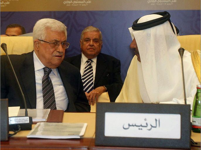 Palestinian president Mahmud Abbas (L) listens to Qatari Premier and Foreign Minister Hamad bin Jassem bin Jabr al-Thani during the Arab Peace Initiative committee meeting in the Qatari capital Doha on July 22, 2012. AFP PHOTO/STR