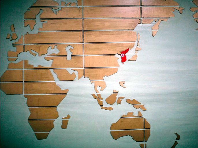 A world map, with the Korea peninsula marked in red, is seen at a hotel reception in Rajin in the Special Economic Zone of Rason City, northeast of Pyongyang, in this August 29, 2011 file photo. North Korean leader Kim Jong-un's uncle -- the man seen as the power behind the young and untested dictator -- went to Beijing on August 13, 2012 in the latest signal that the reclusive state is looking seriously at ways to revive its broken economy. REUTERS/Carlos Barria/Files (NORTH KOREA - Tags: TRAVEL SOCIETY BUSINESS POLITICS)