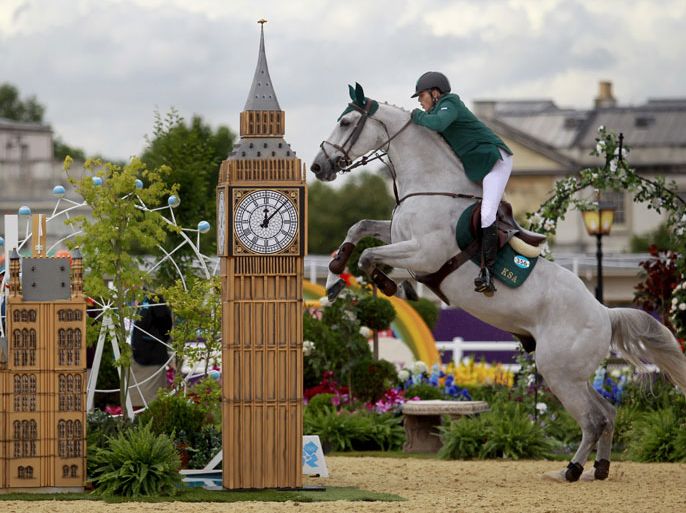 epa03342771 Abdullah Waleed Sharbatly of the Kingdom of Saudi Arabia rides 'Sultan' during Individual Jumping 2nd Qualifier at the the London 2012 Olympic Games Equestrian Jumping competition in Greenwich Park, south east London Britain, 05 August 2012. EPA/JIM HOLLANDER