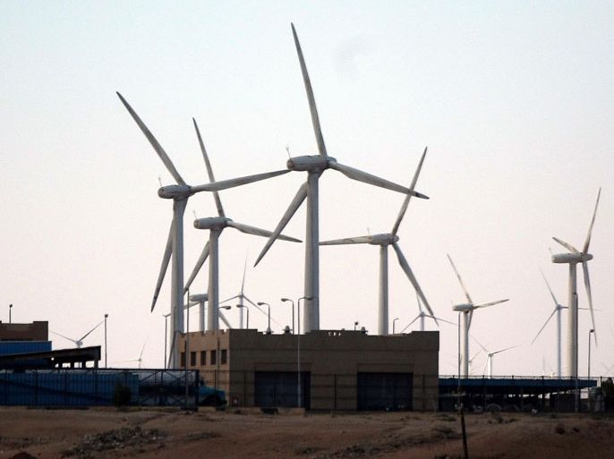 epa02039400 (FILE) In this 04 February 2010 file photograph giant wind turbines dwarf a energy station as they generate electricity at the Zafarana Wind Farm along the Red Sea Coast, 120 kms south of Cairo. Abu Dhabi's green energy firm Masdar is expected to sign 18 February 2010 a joint venture with the Egyptian Electricity and Energy Ministry to build a 200 megawatt wind farm along the Red Sea coast in the vicinity of Suez. Egypt's Red Sea coast is an ideal source of renewable wind energy with the strength, consistency and direction of the wind. Egypt's existing wind turbines that number into the hundreds already generates 430 megawatts and has plans to meet 12 percent of its energy needs by 2020. EPA/MIKE NELSON