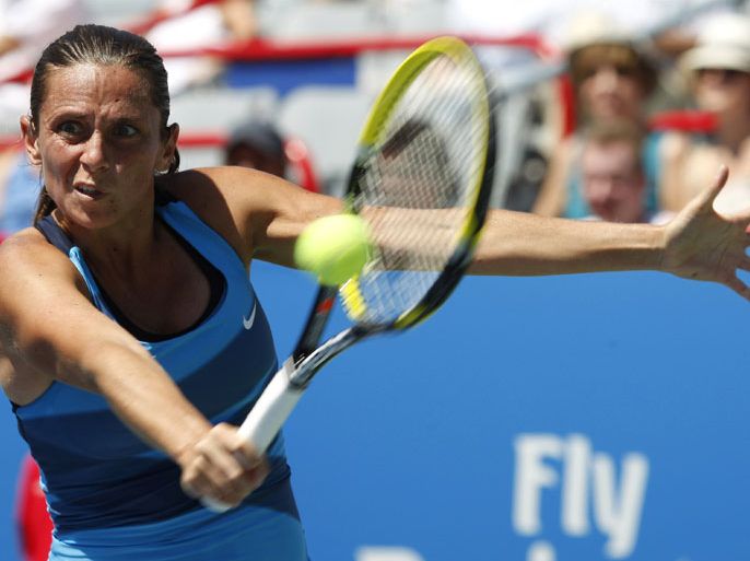 Roberta Vinci of Italy hits a return during her match against Yanina Wickmayer of Belgium at the Rogers Cup tennis tournament in Montreal, August 7, 2012