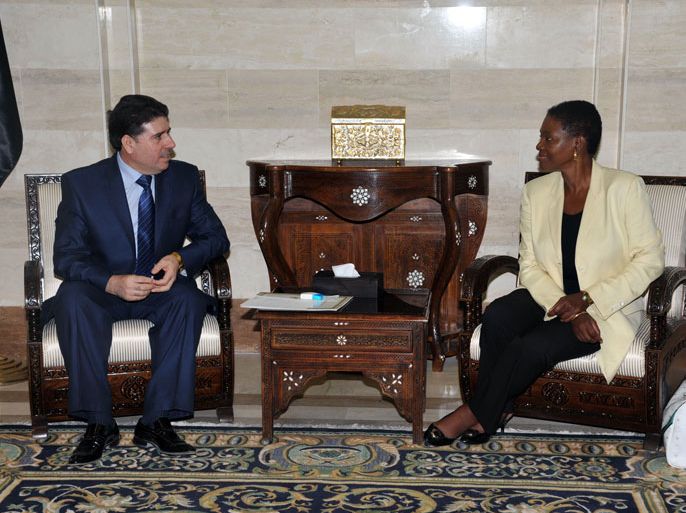 United Nations' humanitarian chief Valerie Amos (R) meets with newly appointed Syrian Prime Minister Syrian Wael al-Halqi in Damascus, on August 14, 2012. Amos also arrived in Damascus on a regional visit "to draw attention to the deteriorating humanitarian situation" and discuss ways of scaling-up relief efforts, her office said. AFP PHOTO/STR