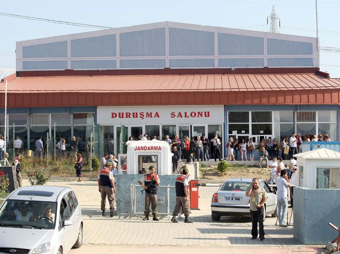 Relatives and Turkish soldiers wait outside the court in Silivri, near Istanbul, on September 20, 2012 during final arguments in the trial of hundreds of active and retired military officers accused of plotting to overthrow the Islamic-rooted government. The two-year-long case was wrapping up in the court, which heard the final testimonies of the suspects in the so-called "Sledgehammer