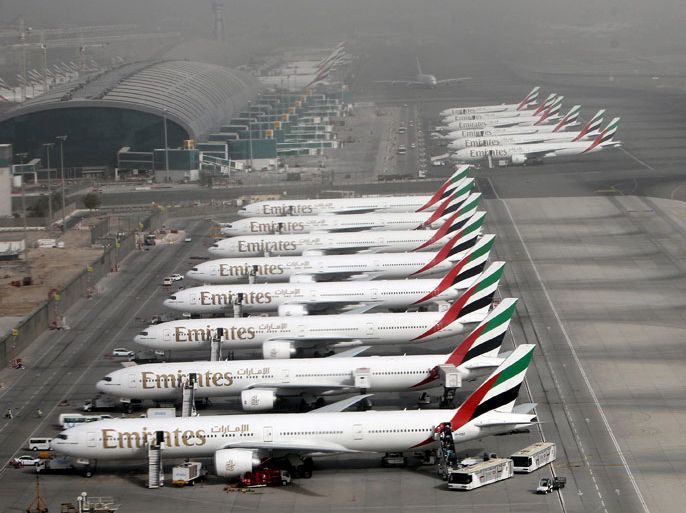epa03238742 An aerial view shows Aircrafts of the Emirates Airlines parked at the Dubai International airport in the Gulf emirate of Dubai, United Arab Emirates, 27 May 2012. EPA/ALI HAIDER
