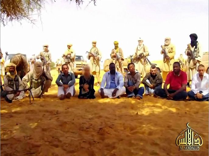 (FILES) This Al-Andalus image grab taken on September 30, 2010 from a video shows hostages seized in Niger by Al-Qaeda in the Islamic Maghreb (Aqmi), among whom are five French, after been were kidnapped in the northern mining town of Arlit on September 16, 2011. Al-Qaeda's North Africa branch on September 20, 2012 threatened to kill French hostages it kidnapped in Niger two years ago, accusing Paris of backing plans for an invasion of Islamist-held northern Mali. AFP PHOTO /Al-Andalus / TV GRAB