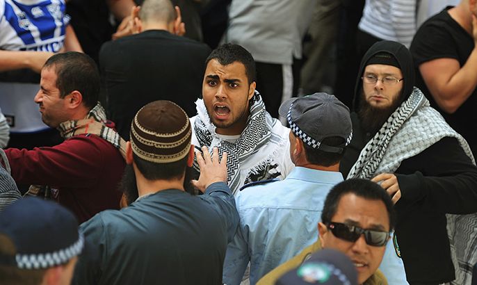 Protesters clash with police in Sydney on September 15, 2012, as a wave of unrest against a film that mocks Islam spread to Australia, bringing hundreds out to demonstrate. Furious protests targeting symbols of US influence flared in cities across the Muslim world on September 14 in retaliation for a crude film made in the United States by a right-wing Christian group that ridicules the Prophet Mohammed. AFP