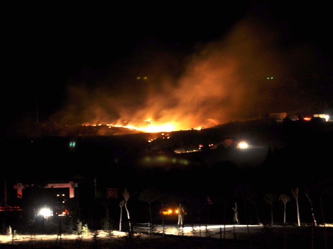 Flames are seen after a huge blast rocked central Turkish province of Afyonkarahisar, on September 6, 2012. A military storage filled with hand grenades exploded, leaving 25 soldiers dead and four others injured. The blast occurred between Atakoy neighborhood and Kanlica village of Afyonkarahisar, close to residential areas but in an isolated territory. Initial reports claimed that the blast occured after a mistake while officers were classifying the hand grenades.