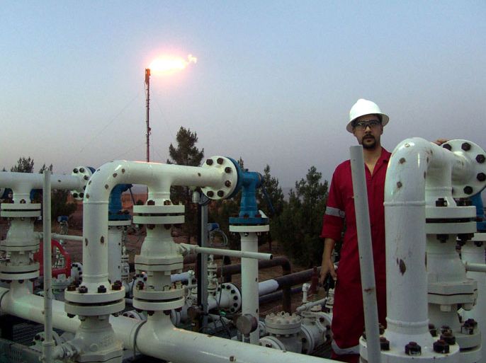 Iraqi worker opening an oil valve at Taq Taq oil field in Erbil, 310 km (190 miles) north of Baghdad, Iraq, on 30 May 2009. The Ministry of Natural Resources in the regional government announced the official start 2009 of oil exports from the Tawke field for 01 June at an average rate of 60,000 bpd, The ministry also said that 40,000 bpd of crude exports from Taq Taq field, which has estimated oil reserves of 1.2 billion barrels, would begin traveling by truck and through an Iraqi-Turkish export pipeline and the exported crude from both fields will be marketed by Iraq's State Oil Marketing Organization (SOMO), noting that the revenue will be deposited to the federal government’s account. EPA/KAMAL AKRAYI